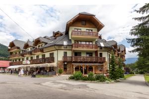 a large building with a gambrel roof at Apartment House Kamzik 26 in Donovaly