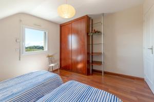 Postel nebo postele na pokoji v ubytování Maison confortable à Plurien avec hammam