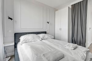 Posteľ alebo postele v izbe v ubytovaní Grand Apartments Chlebova