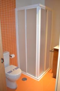 a bathroom with a toilet and a shower at The Factory Residence Hall in Segovia +40 photos