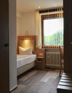 En eller flere senge i et værelse på Hotel Scirocco