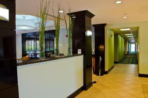 a large room with a large mirror and a walkway at Best Western Plus Miami-Doral/Dolphin Mall in Miami