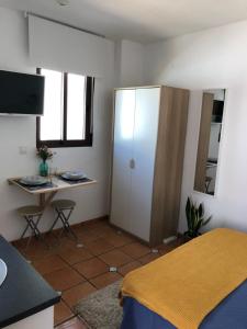 Posteľ alebo postele v izbe v ubytovaní Ático Mirador de Peregrinos
