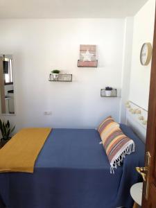 Posteľ alebo postele v izbe v ubytovaní Ático Mirador de Peregrinos