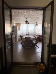 a dining room with a table and some chairs at Casa Daria Ranca in Ranca