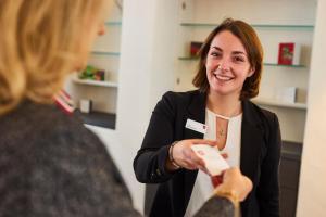 a woman holding a nintendo wii game controller at Post Berching in Berching