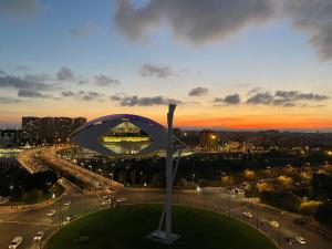 a view of a city with a large sculpture at Barceló Valencia in Valencia