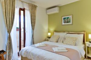 Posteľ alebo postele v izbe v ubytovaní Villa Luciana Spa House, Buje