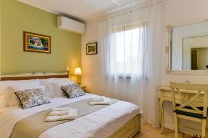 Posteľ alebo postele v izbe v ubytovaní Villa Luciana Spa House, Buje