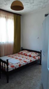 Een bed of bedden in een kamer bij Apartmani Becic
