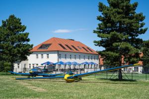 a group of airplanes parked in front of a building at Hotel Spitzerberg by b-smart 