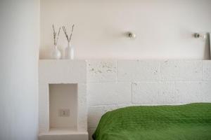 Tempat tidur dalam kamar di Agriturismo Antares