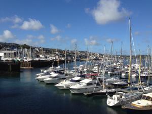 a bunch of boats are docked in a harbor at Camelot Guest House in Falmouth
