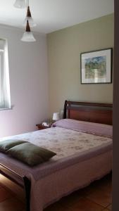 Cama ou camas em um quarto em Apartamentos As Pedreiras 2D