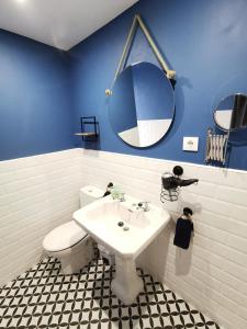 a bathroom with a sink and a toilet and a mirror at APARTAMENTO PORT DE RODA DE BARA -ROC SANT GAIETA in Roda de Bará +45 photos