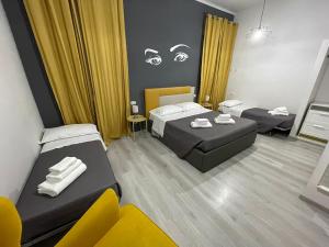 A bed or beds in a room at Sensation House
