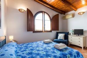 Ein Bett oder Betten in einem Zimmer der Unterkunft Appartamento Perugino