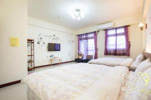 Postel nebo postele na pokoji v ubytování Hometown Times Homestay