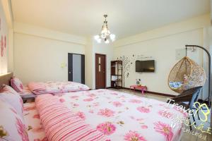 Postel nebo postele na pokoji v ubytování Hometown Times Homestay