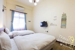 Postel nebo postele na pokoji v ubytování Hometown Times Homestay