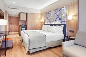 Ένα ή περισσότερα κρεβάτια σε δωμάτιο στο Eurostars Guadalquivir