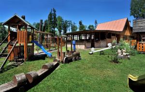 a playground with a slide at APLEND Villas Tatry Holiday in Veľký Slavkov