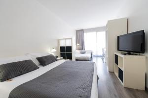 Posteľ alebo postele v izbe v ubytovaní Aparthotel Atenea Calabria