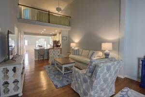 a living room with a couch and chairs at 36528 Putter Ln, Frankford in Frankford