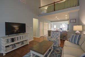 a living room with a couch and a flat screen tv at 36528 Putter Ln, Frankford in Frankford