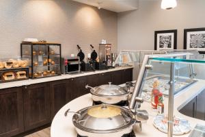 a kitchen with two pots and pans on a counter at Staybridge Suites - Nashville - Vanderbilt, an IHG Hotel in Nashville