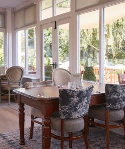 a dining room with a table and chairs at Riverside Inn by Chef & Brewer Collection in Shrewsbury +54 photos