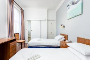 Cama o camas de una habitación en Imperial Hotel