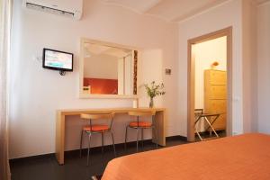 A bed or beds in a room at Affittacamere La Piazzetta