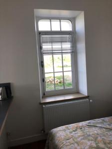 En eller flere senge i et værelse på Charmant gite en rez-de-jardin