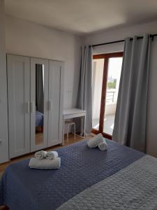 Postel nebo postele na pokoji v ubytování Apartman Family Čović