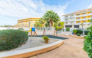 a playground in the courtyard of a building at Nora Nice in Moraira