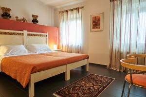 A bed or beds in a room at Affittacamere La Piazzetta