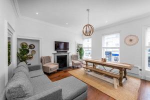 a living room with a couch and a table at Argyle - Stunning 5 bed Luxury Home - Pulteney Bridge, Bath in Bath
