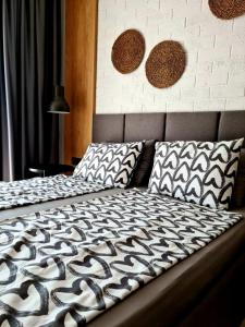 Postel nebo postele na pokoji v ubytování Studio Greenn Life Beach Resort