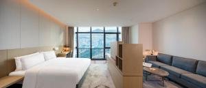 Postel nebo postele na pokoji v ubytování Holiday Inn Express Shenzhen Haiyuan City by IHG + 37 fotografií