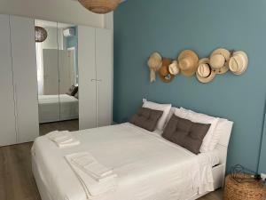 Ένα ή περισσότερα κρεβάτια σε δωμάτιο στο Casa Aiga Marina