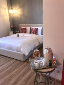 Postel nebo postele na pokoji v ubytování Adamas House Hotel Boutique