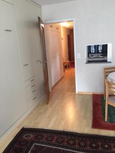 an empty living room with a table and a kitchen at Barga GP in Davos