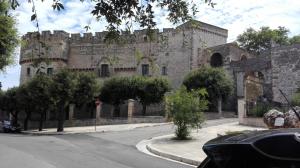 an old stone building on the side of a street at B&B CASAVACANZE CHIESA MADRE in Carovigno