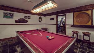 a pool table with balls on top of it in a room at Ardagh Hotel & Restaurant in Clifden