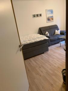 Postel nebo postele na pokoji v ubytování Mit Terrasse und Garten: Ferienparadies zwischen Süd-und Hooksielstrand