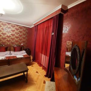 A bed or beds in a room at GIO-NIKA