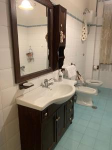 a bathroom with a sink and a toilet at B&B arpaia in Arpaia +16 photos
