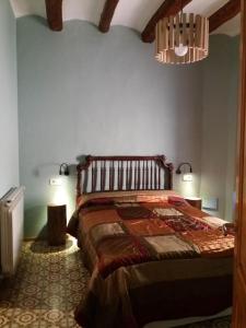 Postel nebo postele na pokoji v ubytování Apartaments Falset