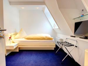 Postel nebo postele na pokoji v ubytování Hotel Linde